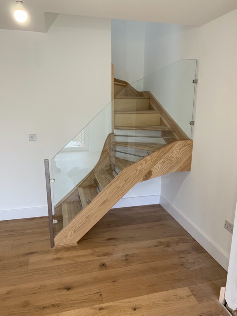 Modern Ash Staircase with stainless steel bars and glass balustrade